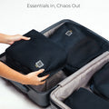 Storage pods packing cubes in suitcase, organizing essentials efficiently.