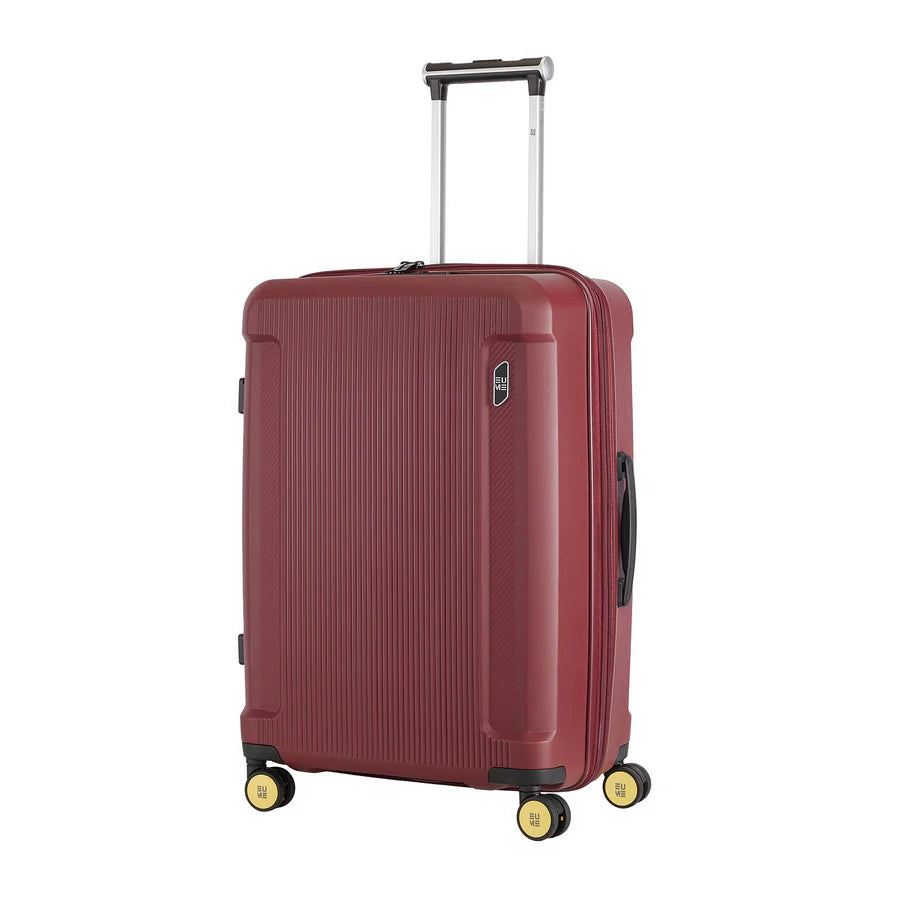 Nomad Set of 3 stylish red luggage with four wheels.