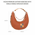 Vegan cinnamon hobo bag with spacious single handle design.