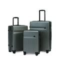 Three grey hard-shell suitcases in varying sizes with wheels.