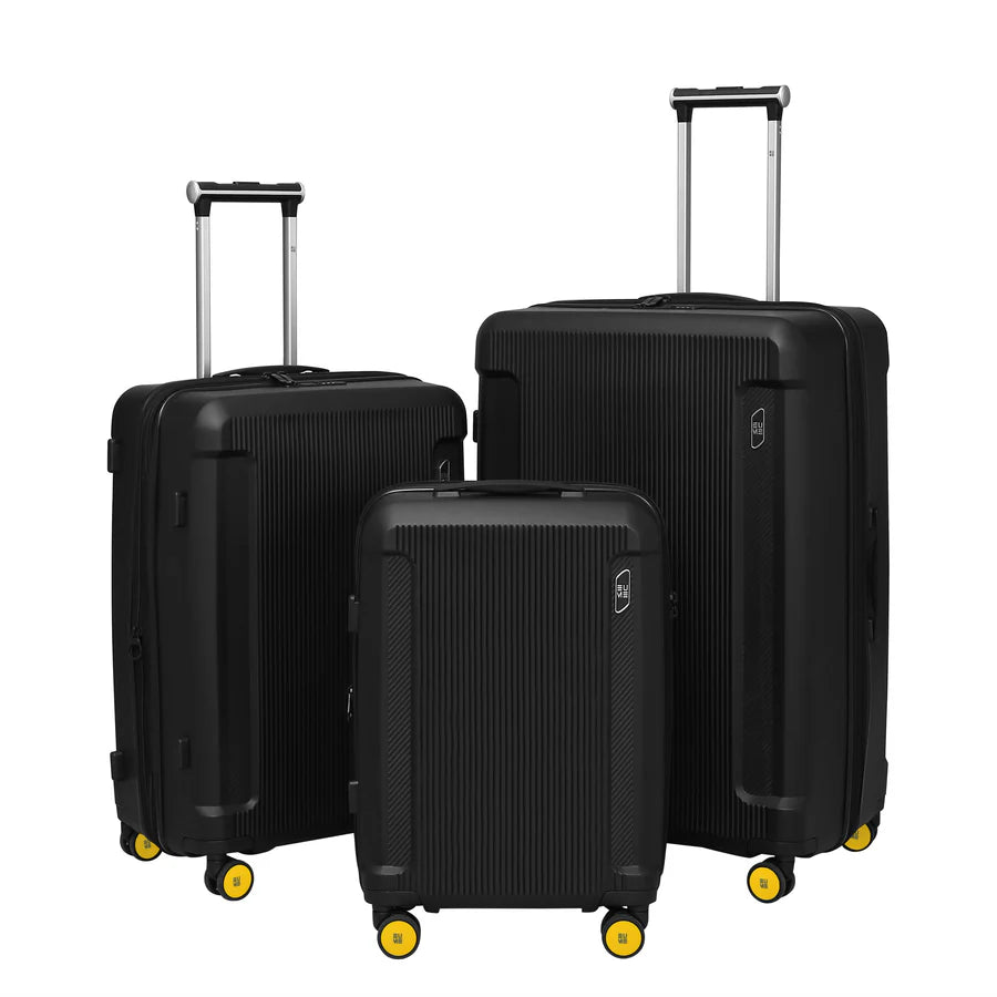 Stylish Nomad Cabin luggage set in black with yellow wheels.