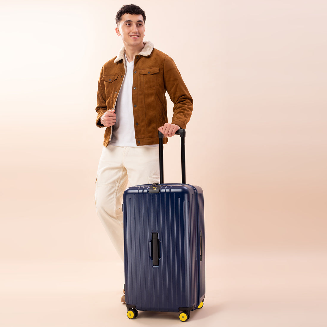 Stylish navy blue Trunk Check-In Plus suitcase with smooth wheels.