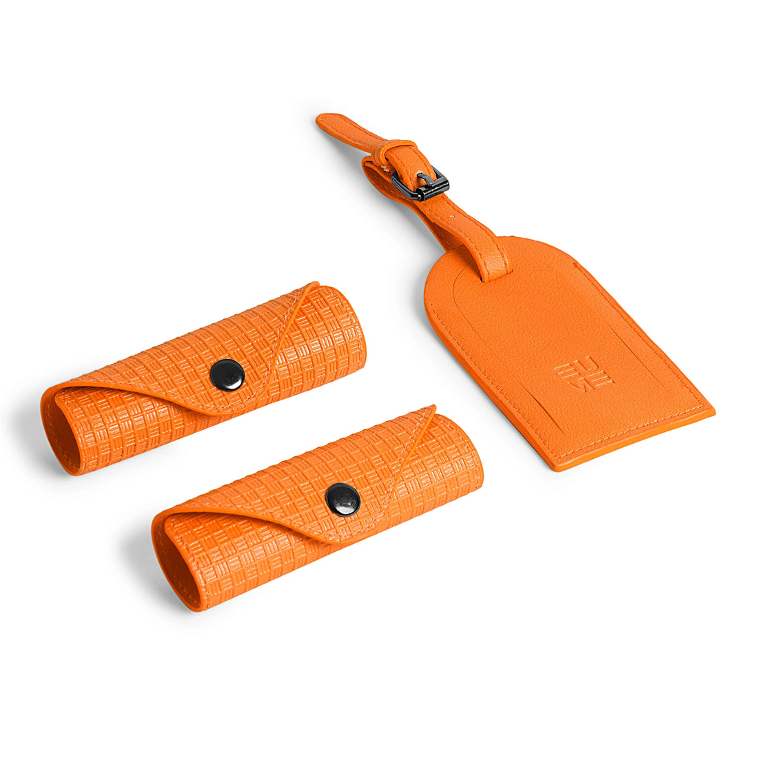 Bright orange accessory kit including pouches and luggage tag.