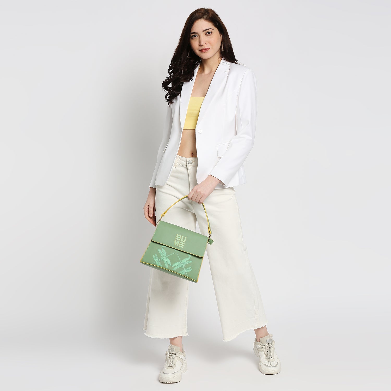 Spike-tail Satchel Handbag styled with a chic outfit for women.