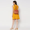 Petal-tail Sling Handbag/Backpack worn as a stylish backpack.