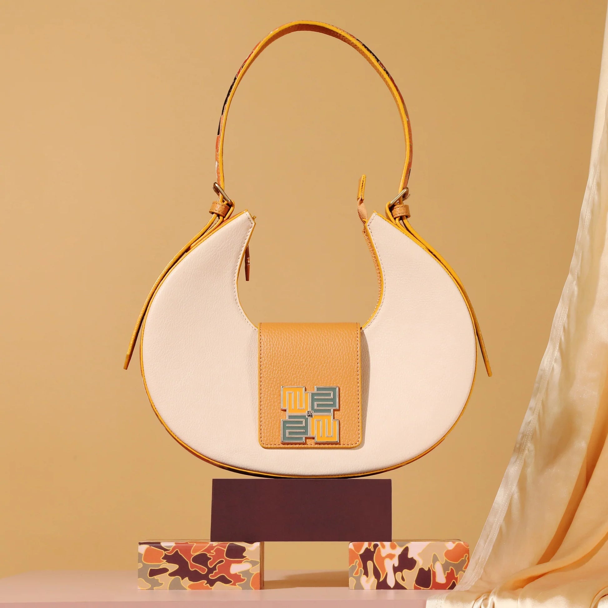 Chestnut Saddle Bag featuring contemporary design and two-tone color scheme.