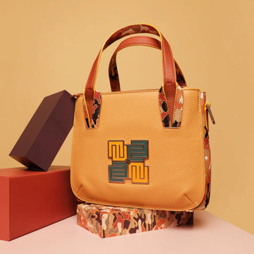 Stylish Marshmallow Tote Bag in yellow and patterned design.