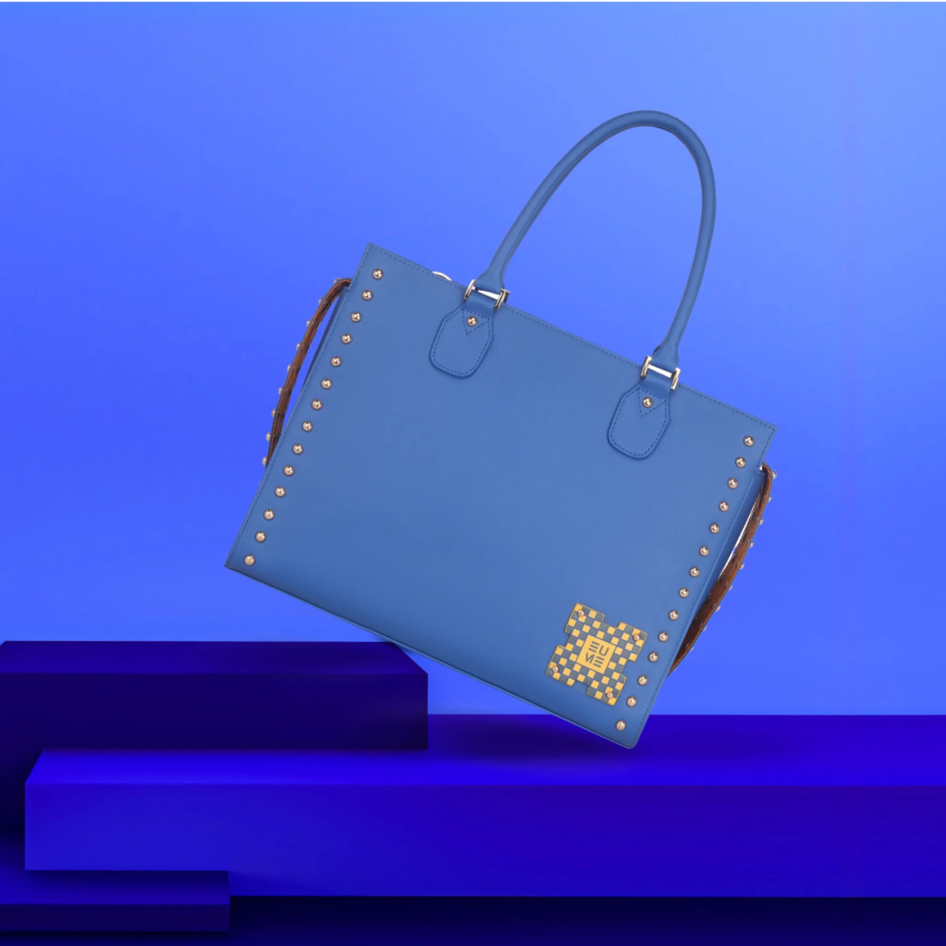 Daffodil Satchel Laptop Handbag in stylish blue with studs.