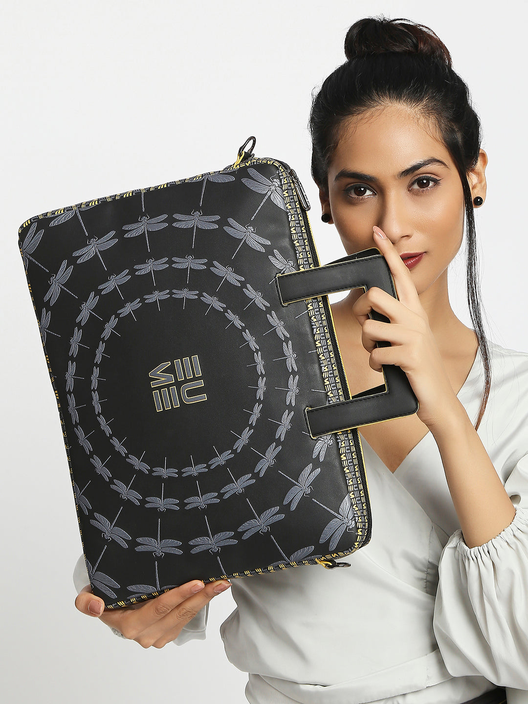 Stylish Dasher laptop sleeve with dragonfly design and dual handles.