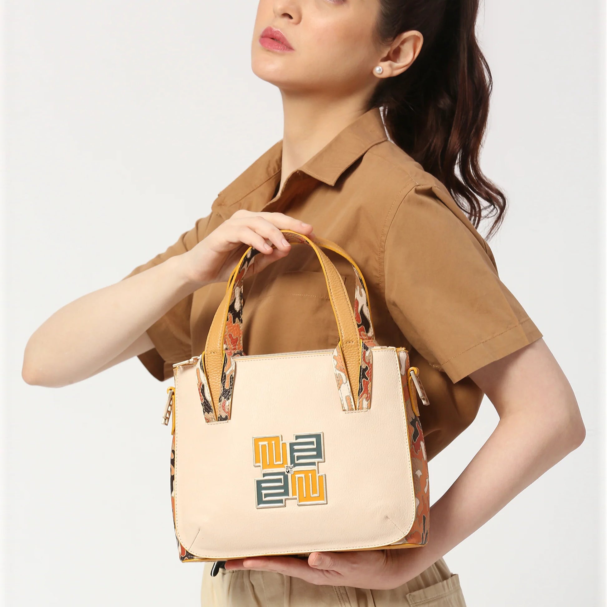 Marshmallow Tote Bag in stylish design, held by model.