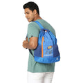 EUME Mumbai Indians 19 Ltrs Drawstring Backpack worn by a man.