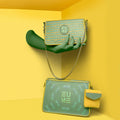 Damsel Saddle 2-in-1 detachable handbag on a vibrant yellow background.