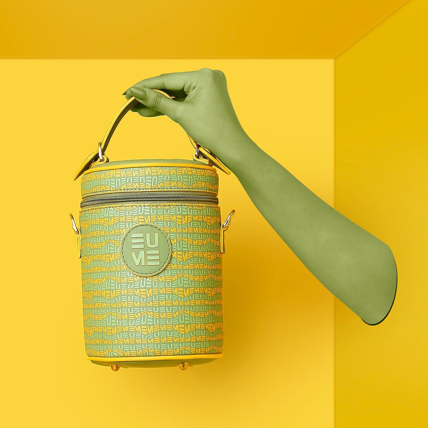 Stylish Picassu Cosmetic Bag in vibrant colors hanging against yellow background.