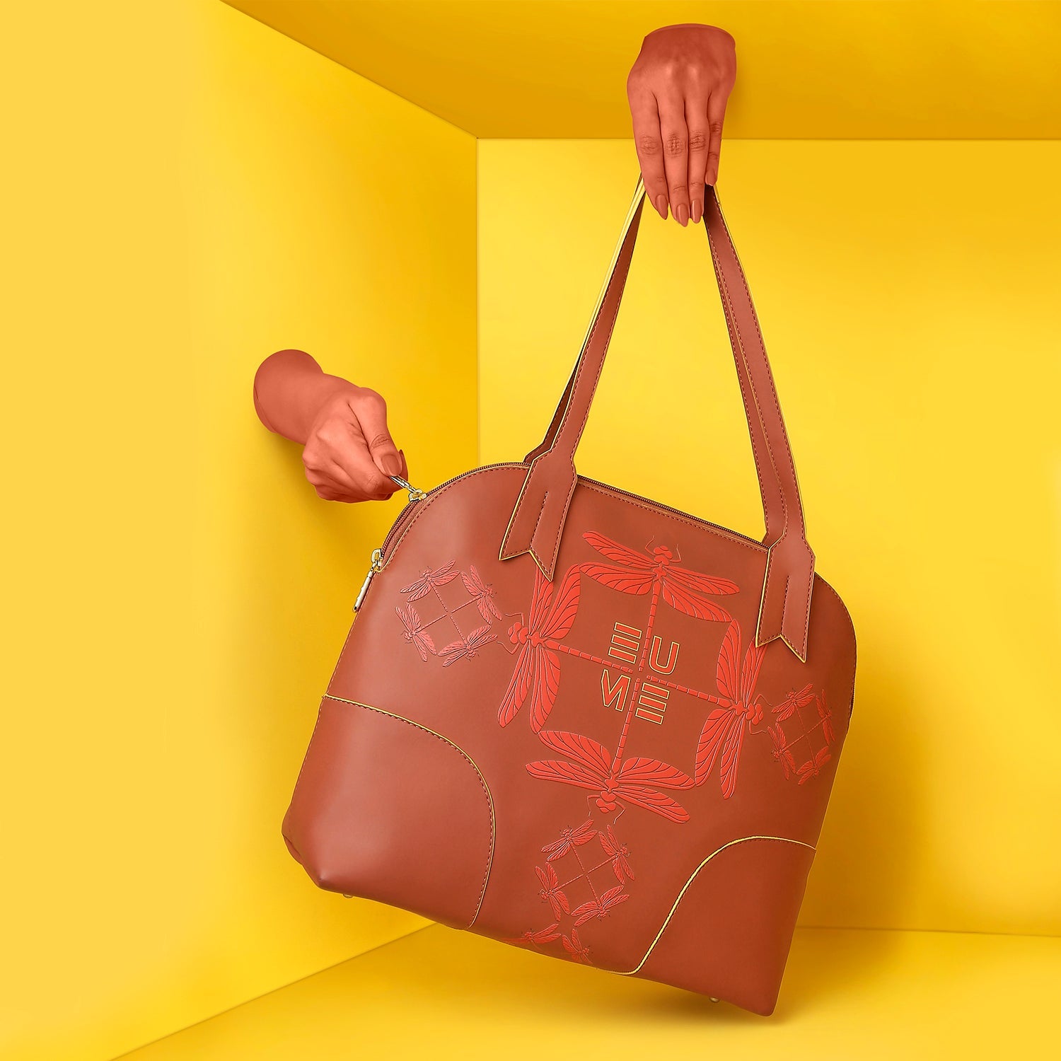 Luna Bowling Handbag displayed against a vibrant yellow background.