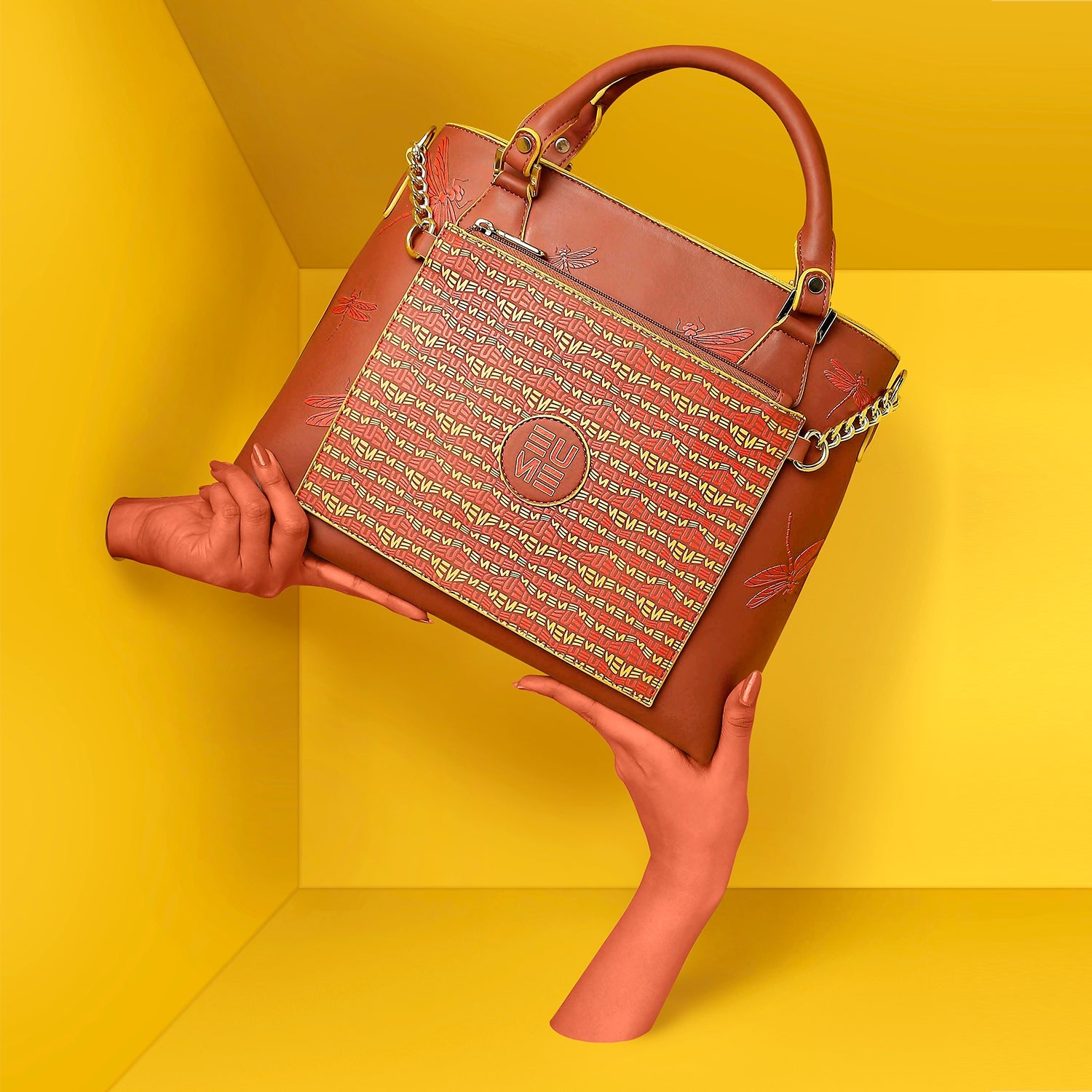 Stylish Skimmer Tote Handbag on a vibrant yellow background.