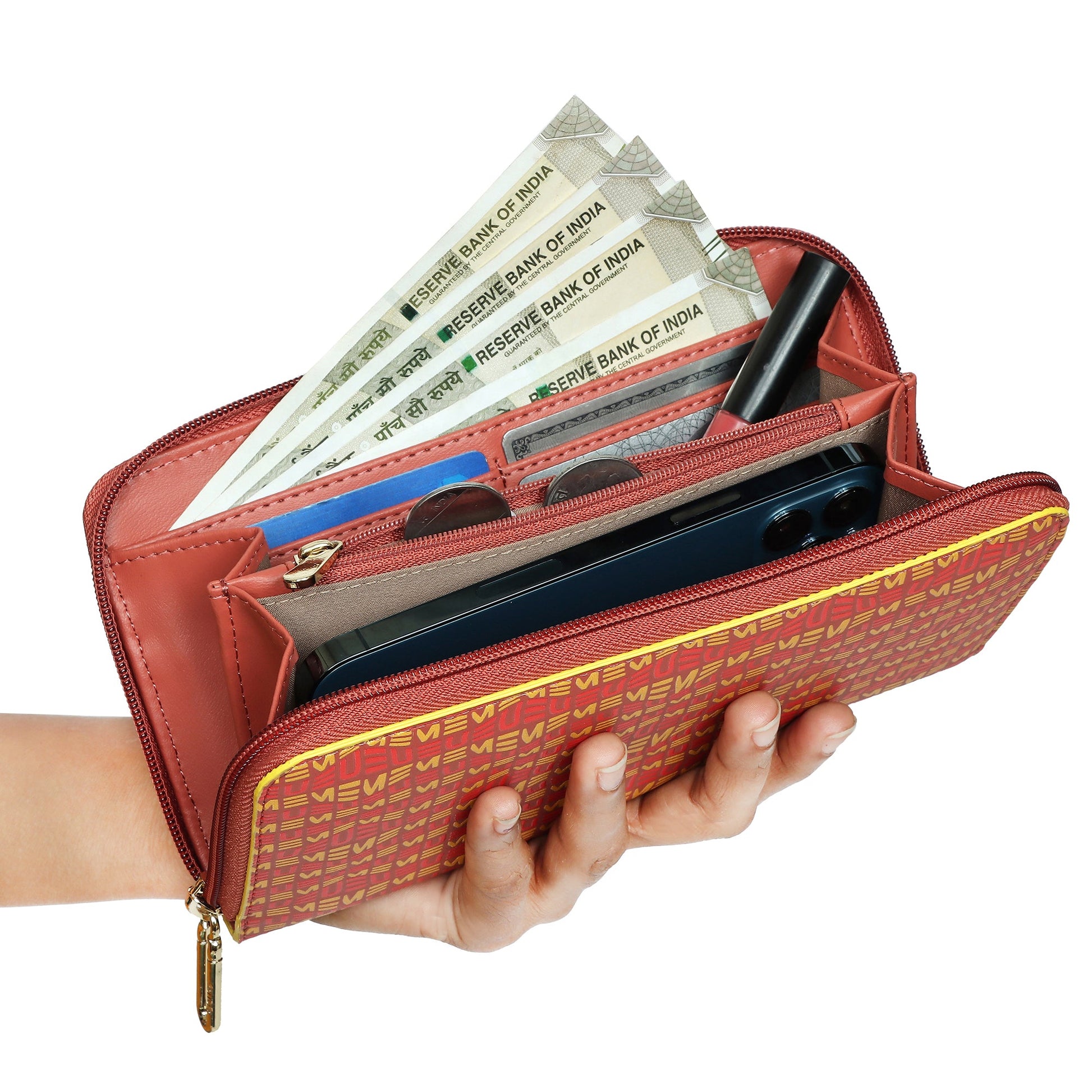 EUME Bandwing Clutch showcasing cash, phone, and cards in hand.