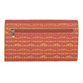 EUME Firefly Clutch with vibrant red and yellow pattern and zipper pocket.