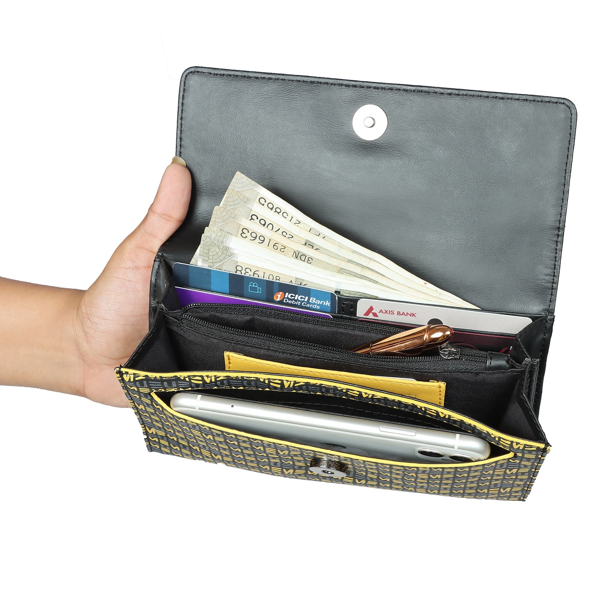 EUME Firefly Clutch shown with cash, cards, and phone inside.