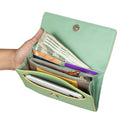 EUME Firefly Clutch with organized compartments for cash and cards.