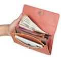 EUME Firefly Clutch with cash, cards, and phone compartment.