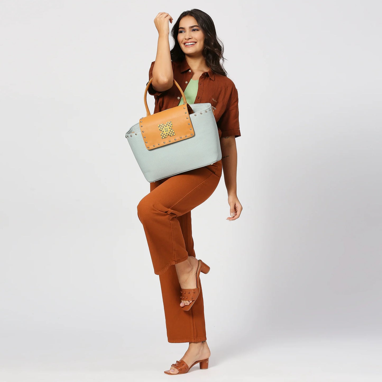 Stylish Orchid single sling laptop tote bag in a fashionable setting.