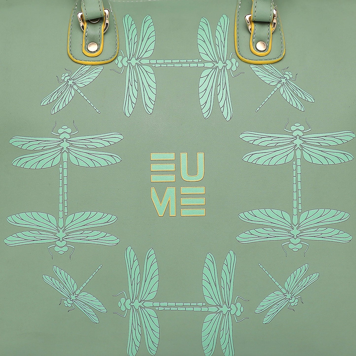 Stylish green handbag with dragonfly design, perfect for laptops.