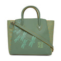 Stylish green Spreadwing Tote Handbag with dragonfly design and shoulder strap.