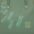 Spreadwing Tote Handbag featuring green dragonfly design on smooth surface.