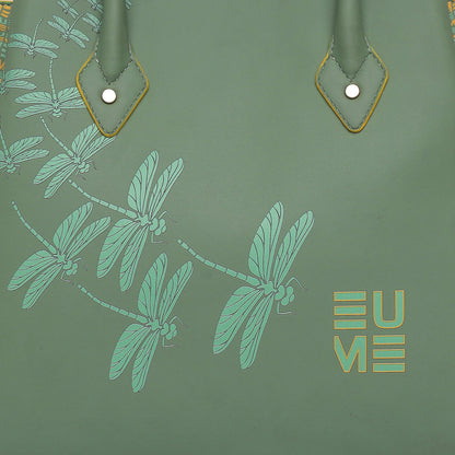 Spreadwing Tote Handbag featuring green dragonfly design on smooth surface.