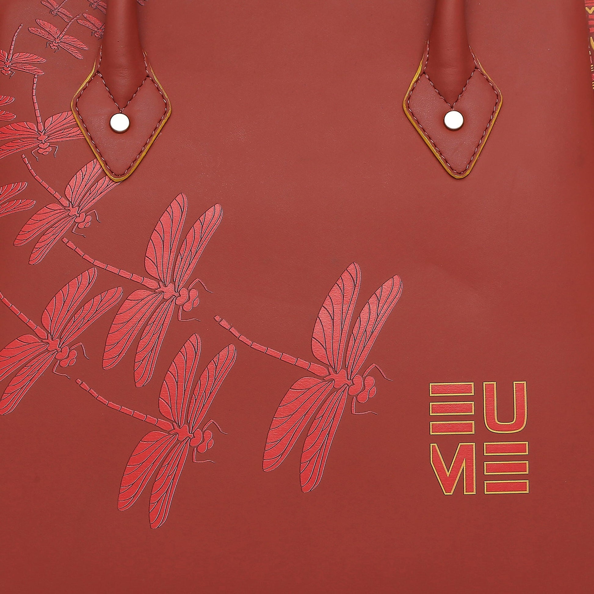 Spreadwing Tote Handbag with dragonfly design and stylish leather details.