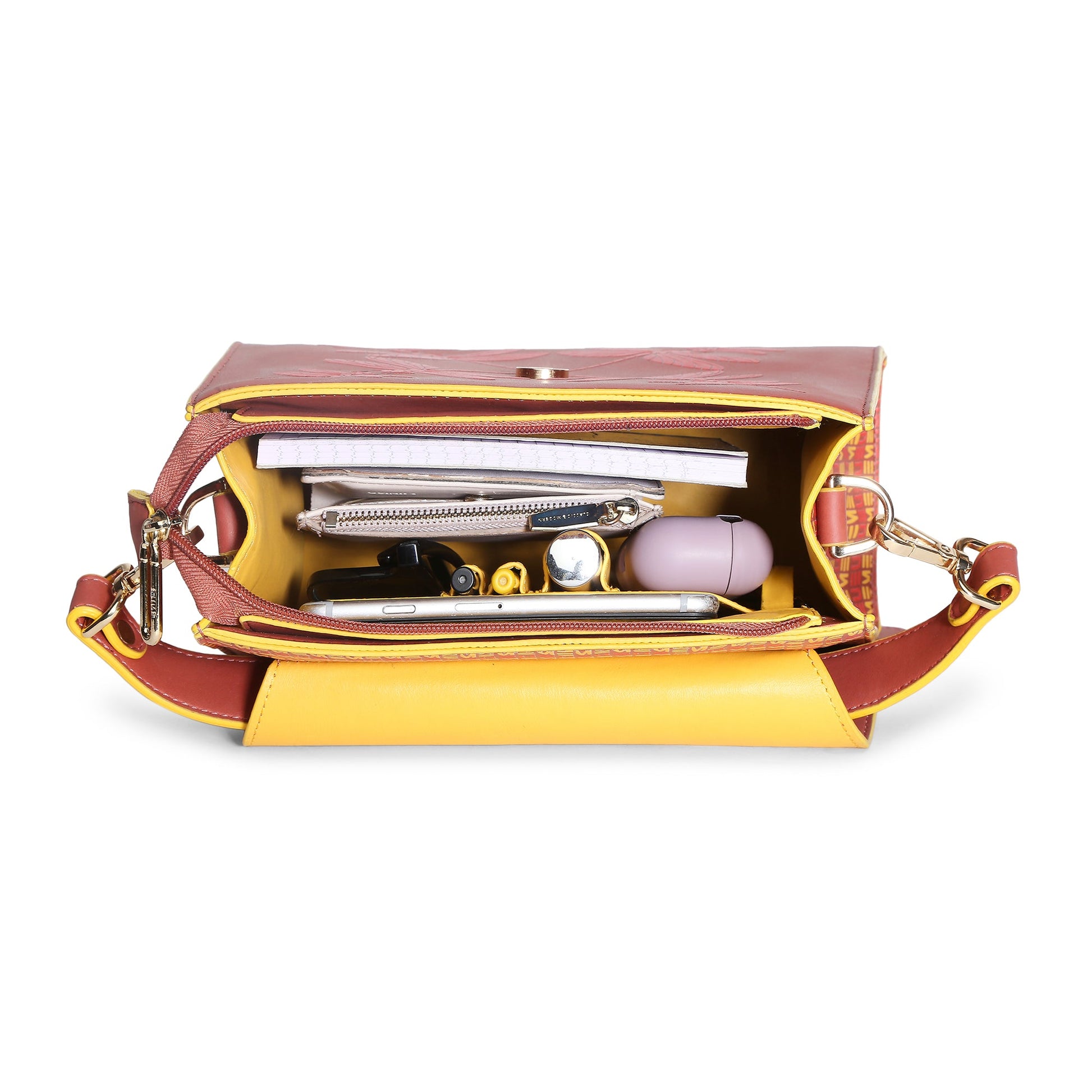 Interior view of Spike-tail Satchel Handbag with organized items.