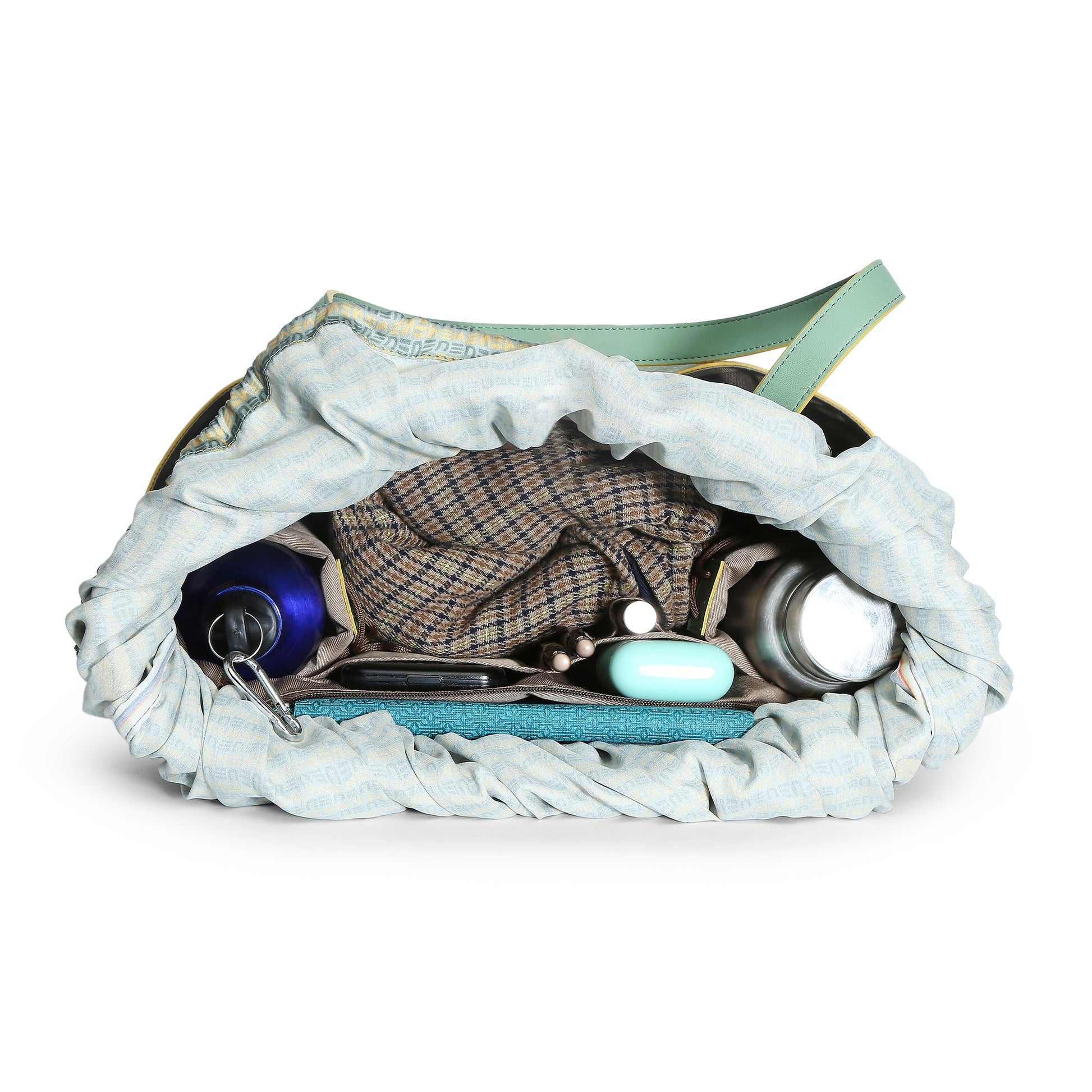 Interior view of Clubtail Bucket Bag showcasing organized items.