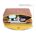 Inside view of Petal-tail Sling Handbag with organized items.