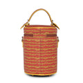 Colorful round Picassu cosmetic bag with stylish design and handle.