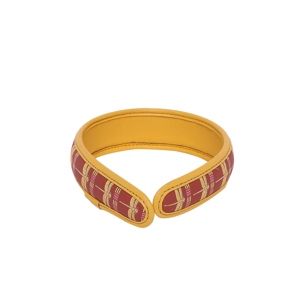 Gabbi Hairband with red and gold pattern, stylish accessory for women.