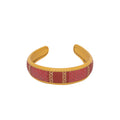 Stylish Lola Hairband with gold accents and decorative pattern.