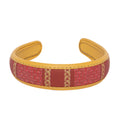 Stylish red and yellow Lola hairband with intricate design.