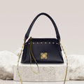 Stylish black Rose Tote Handbag with gold studs and chain strap.