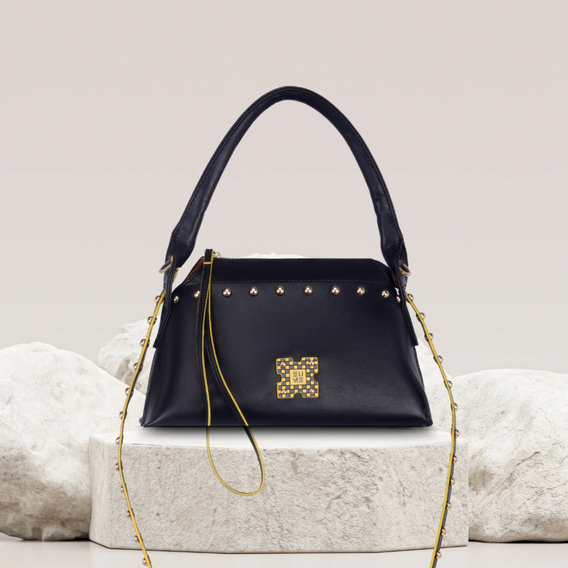 Stylish black Rose Tote Handbag with gold studs and chain strap.