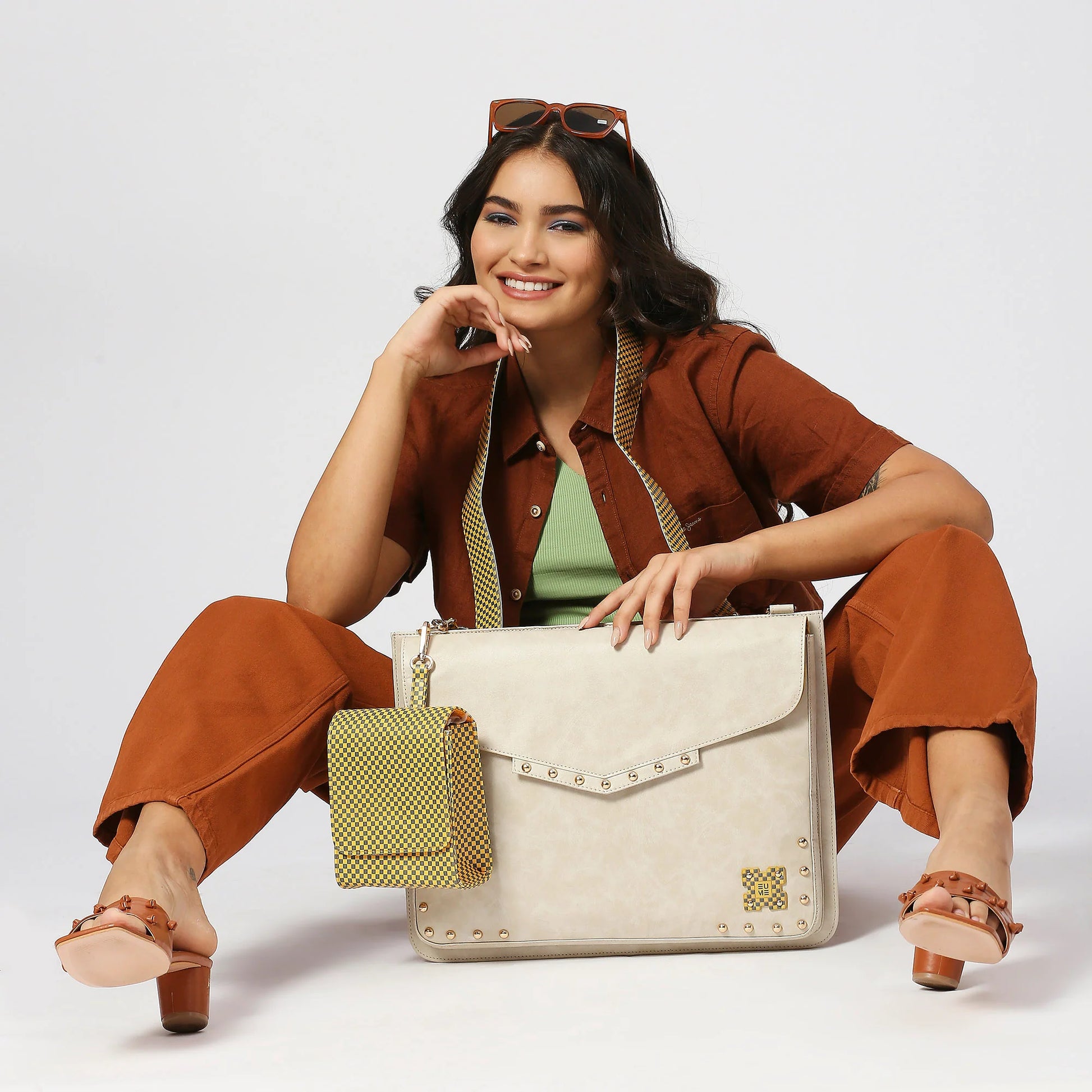 Sage Laptop Messenger Bag modeled by a smiling woman, stylish and functional.