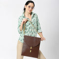 Hibiscus Laptop Sleeve showcased on model with stylish brown bag.