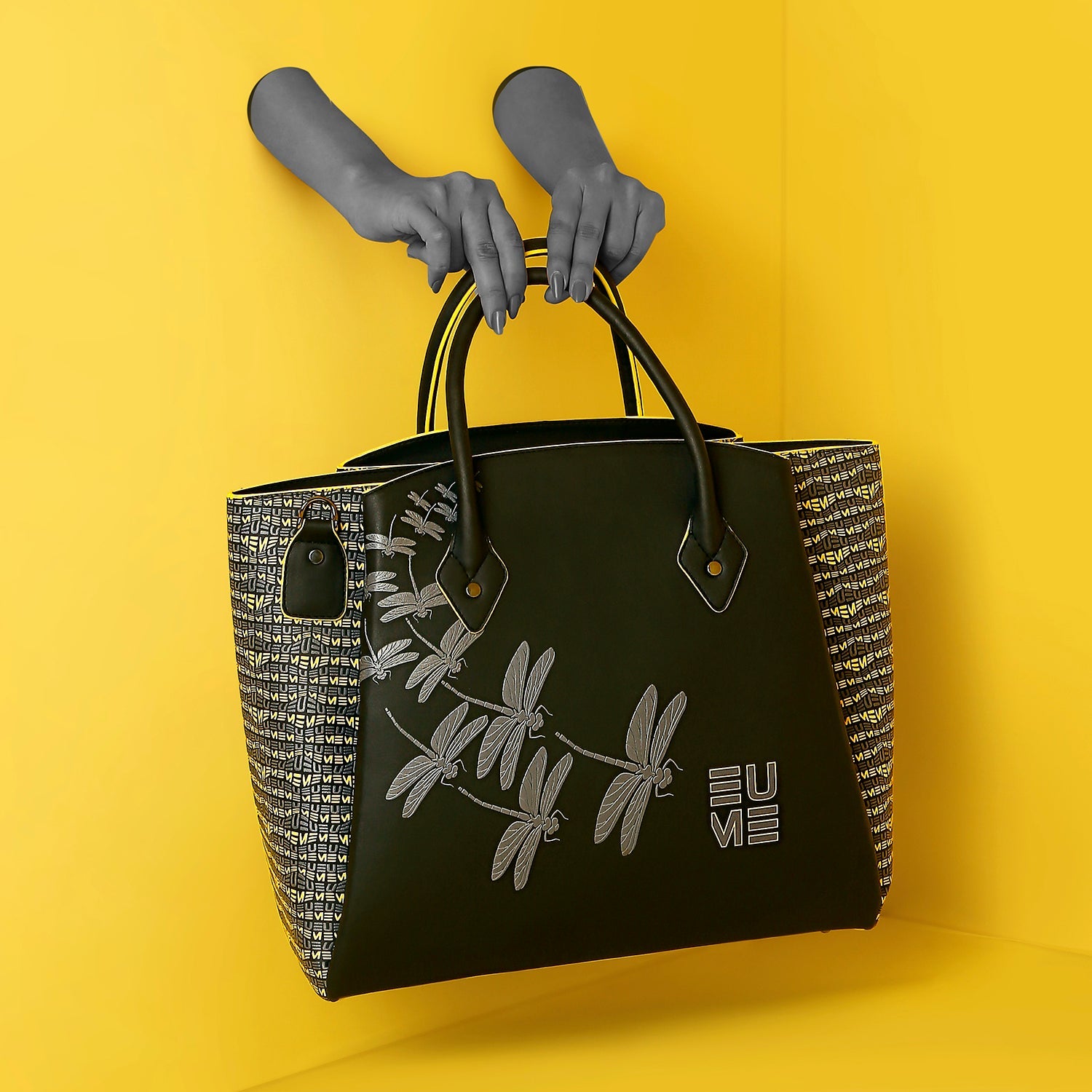 Stylish Spreadwing Tote Handbag in black and woven design.