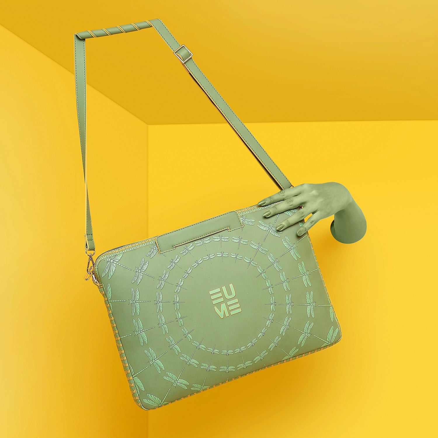 Stylish Dasher Laptop Sleeve in green, featured against a vibrant yellow background.