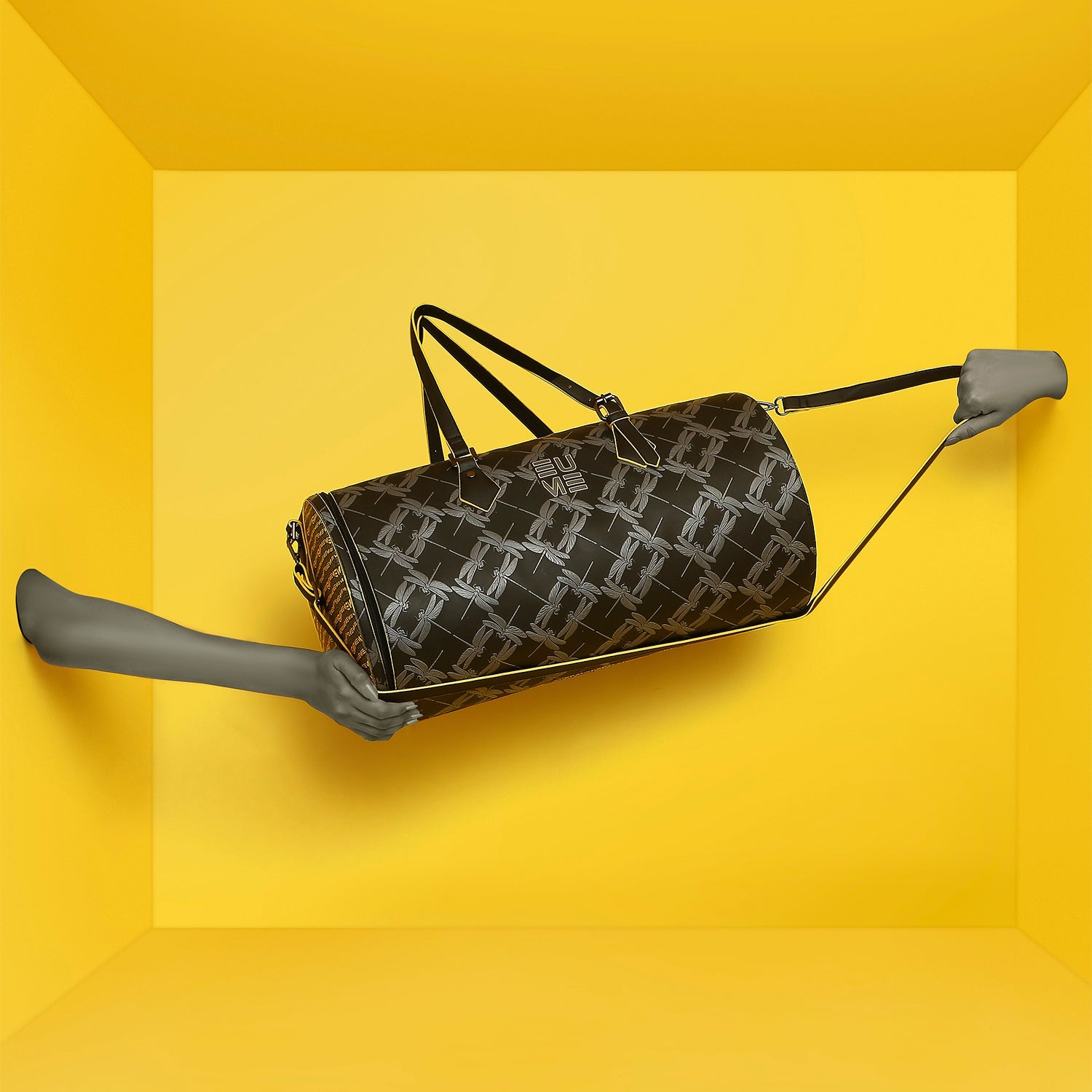 Stylish Chopper Duffel Bag against a vibrant yellow background.