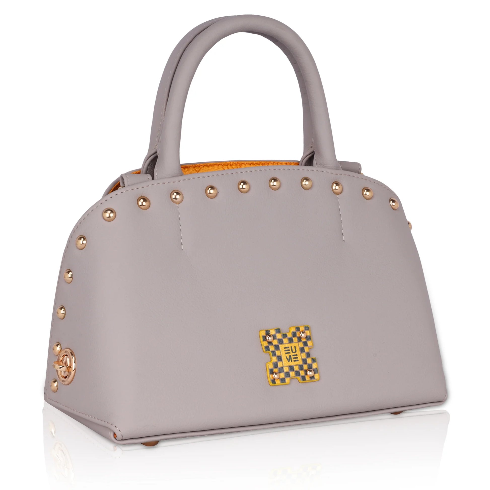 Marigold satchel bag in gray leather with gold studs.