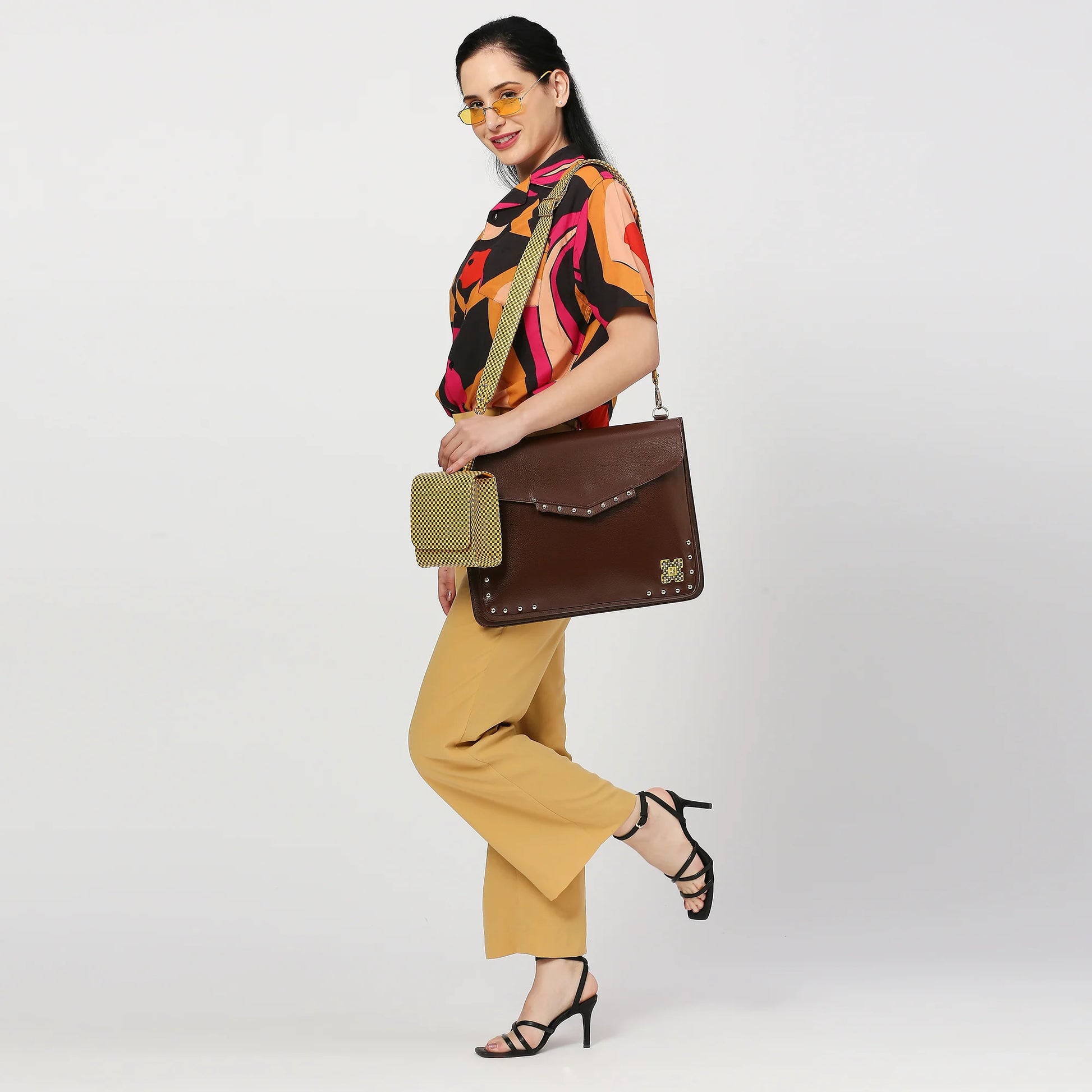 Sage Laptop Messenger Bag styled with vibrant outfit, perfect for modern professionals.